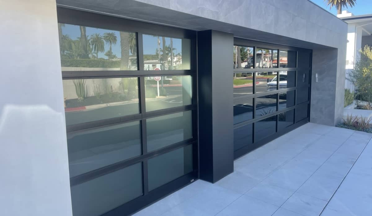 A modern new garage door on a suburban house.