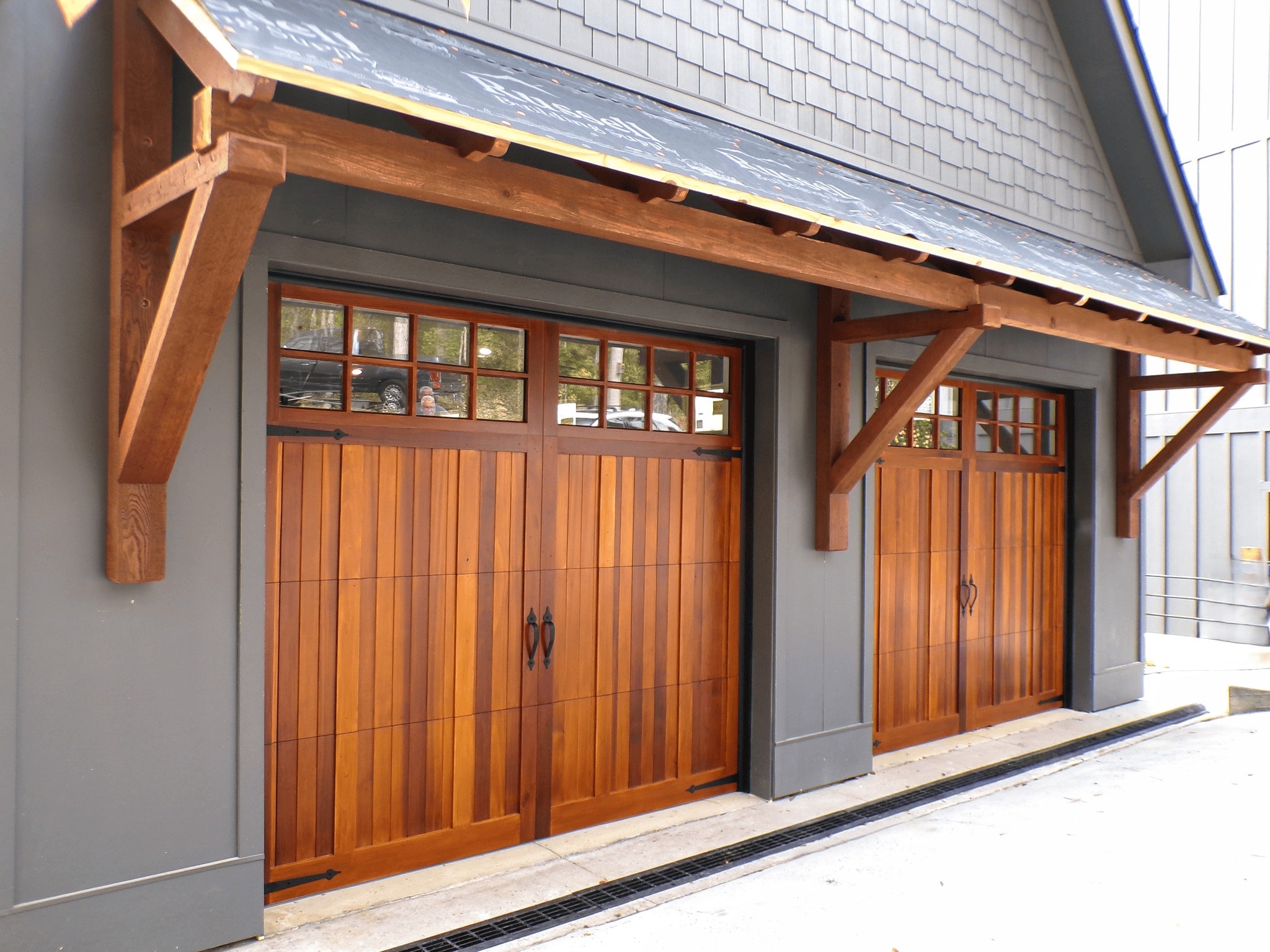 A durable steel carriage style garage door.
